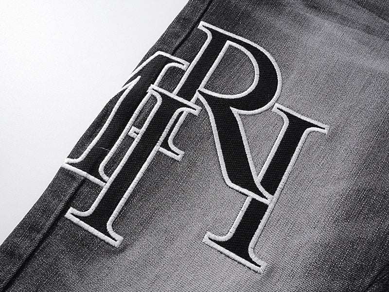 AMIRI Black Faded Logo Skinny Jeans